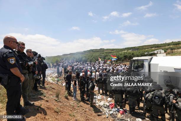 Israeli security forces deploy to disperse a protest by members of the local community near the Druze village of Majdal Shams in the Israel-annexed...
