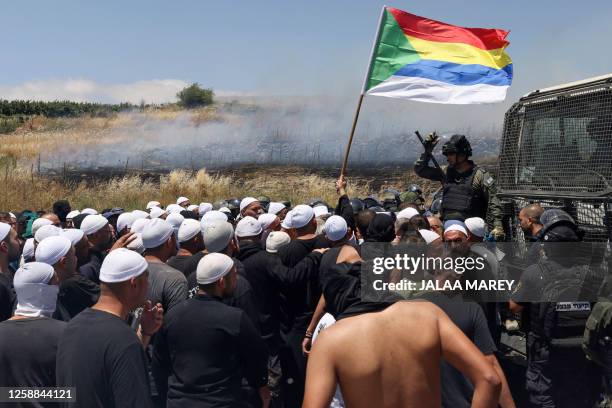 Israeli security forces deploy to disperse a protest by members of the local community near the Druze village of Majdal Shams in the Israel-annexed...