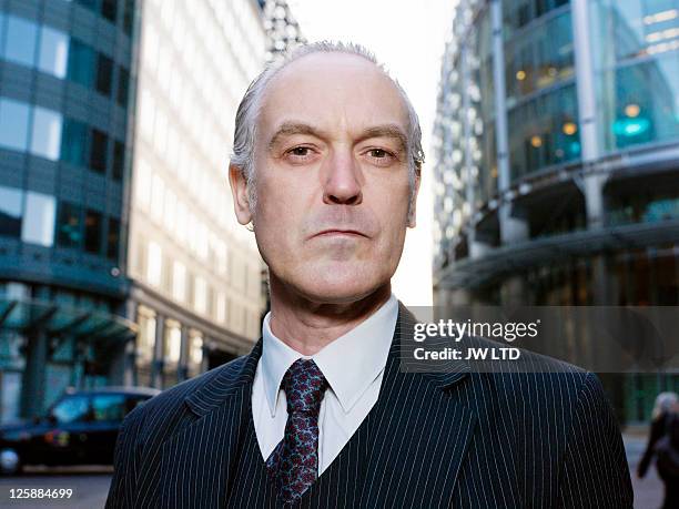 mature businessman in city, close up - pinstripe stock pictures, royalty-free photos & images