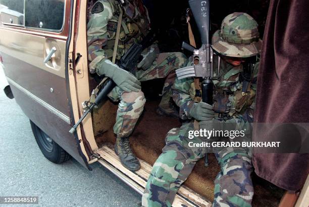 Drug enforcement officers prepare to raid a marijuana plantation in the Angeles Forest outside Los Angeles, CA 18 September. Nine hundred and twelve...