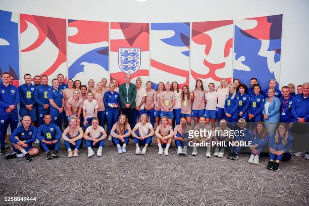 Britain's Prince William, Prince of Wales poses with England Women's team players and members of staff during a visit at St George's Park, in...