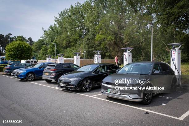 Full electric vehicle charging station at Beaconsfield Services on the M40 in Buckinghamshire on the 18th of June 2023 in United Kingdom. As electric...