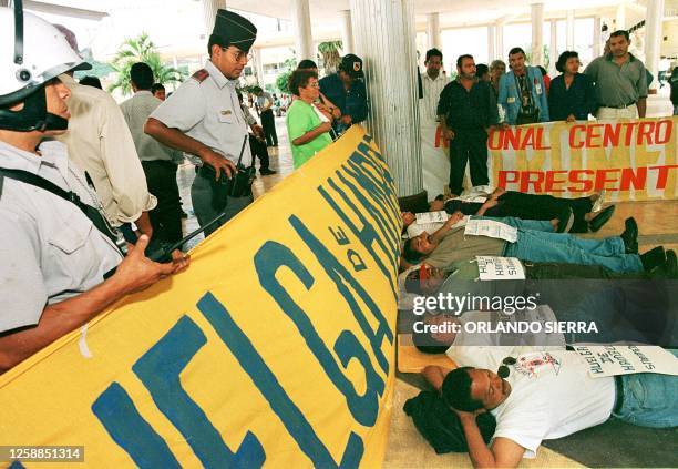 Police observe 11 August in Tegucigalpa, Honduras, our men and three women, members of the medical workers syndicate, as they declare their intent to...