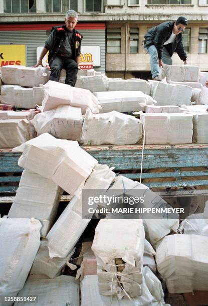 Brazilian police dump sacks of marijuana in front of police headquarters in Sao Paulo 15 July 1999. Some six tons of the drug were confiscated in...