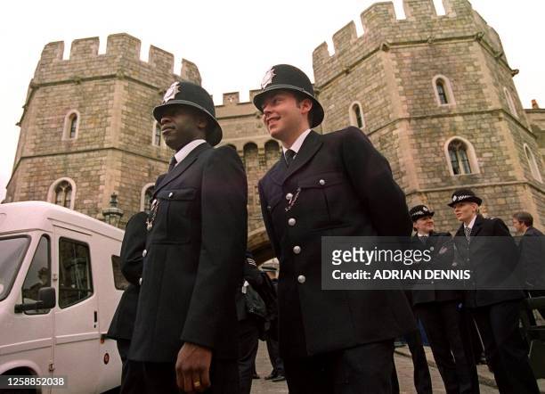 Policeman stand guard outside the Henry VIII gate to Windsor Castle providing security for the royal wedding of HRH Prince Edward and Sophie...