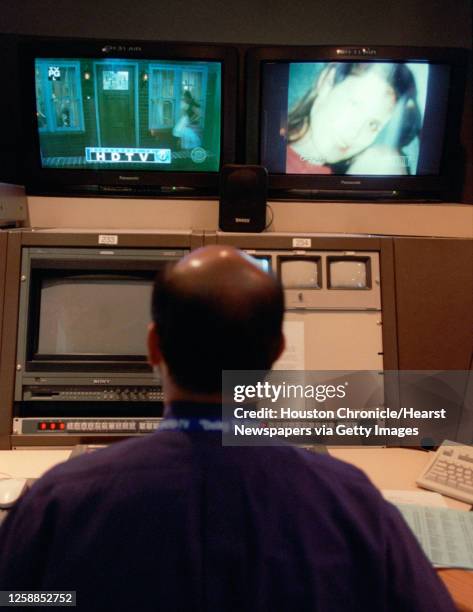 Rudy Gonzalez, Technical Operations Supervisor, with a high definition monitor for Channel 11 KHOU's digital channel, on the left side, and a...