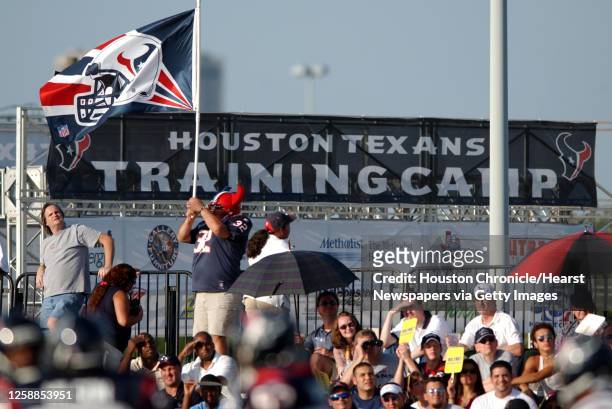 "Big Tex" A.K.A. J.C. Chapa, of Houston, waves his flag from the top of the stands, during the Houston Texans first public practice of the training...