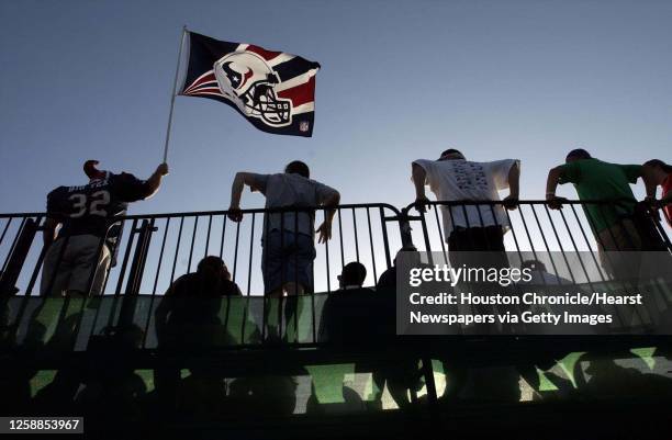 "Big Tex" A.K.A. J.C. Chapa, of Houston, waves his flag from the top of the stands, during the Houston Texans first public practice of the training...