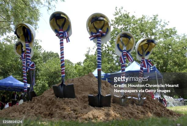 Shovels with hard hats sitting on their handles wait the groundbreaking ceremony at Hardy Tidwell Park of the Houston Veterans of War Memorial at...