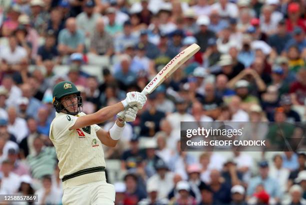 Australia's Pat Cummins watches the ball after playing a shot on day five of the first Ashes cricket Test match between England and Australia at...