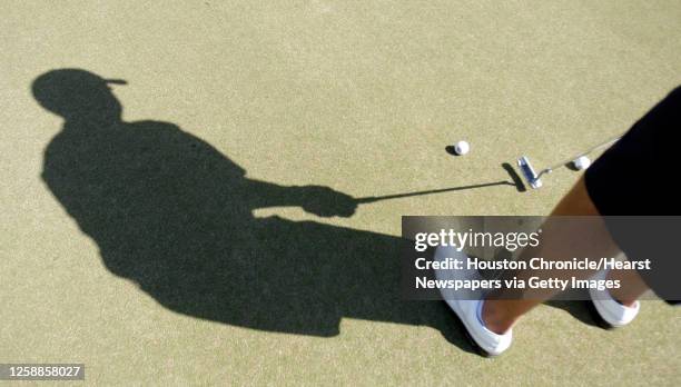 Shadow of golfer Cory Whitsett as he putts, for the 2008 Golf Guide special section, photographed at the Shadow Hawk Golf Club, Friday, March 14 in...