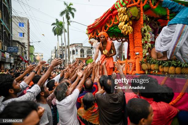 Hindu community takes part as the idols of Hindu God Jagannath, his brother Balabhadra and sister Subhadra are taken out in a grand procession in a...