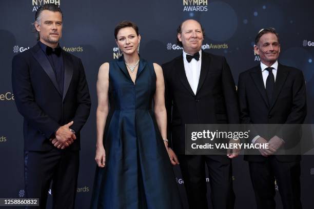 Princess Charlene of Monaco poses with cast members of the TV Series "Buddy games", US actor Josh Duhamel , Michael Luisi and Dan Bakkedahl , during...