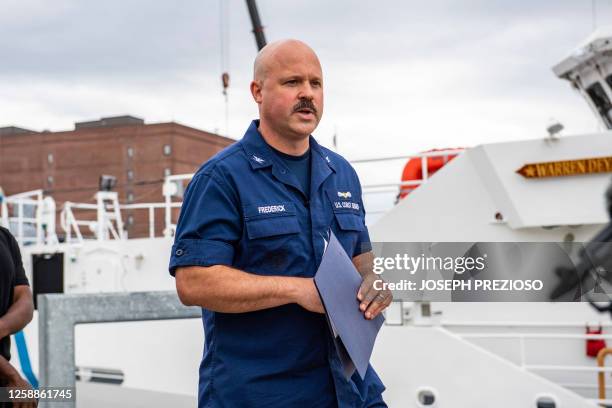 Coast Guard Captain Jamie Frederick arrives to speak during a press conference about the search efforts for the submersible that went missing near...