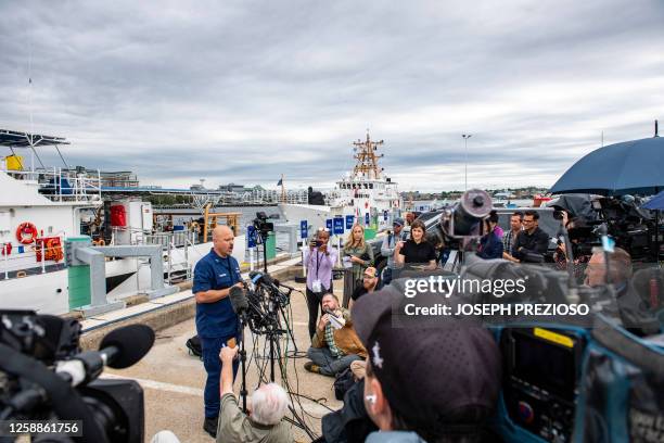 Coast Guard Captain Jamie Frederick speaks during a press conference about the search efforts for the submersible that went missing near the wreck of...