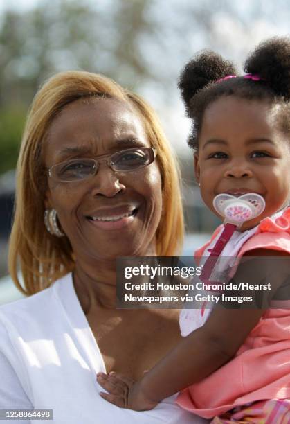 Early voter, Margie Mitchell, with granddaughter JaBria Lomax, 16-months, talks about her voting experience at Kashmere Multi-Purpose Center, Oct. 19...