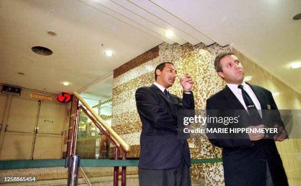 Two security guards, talk in the entrance of Cinema 5 of the commercial center Morumbi Shopping, in Sao Paulo, Brazil 04 November, 1999. Mateus da...