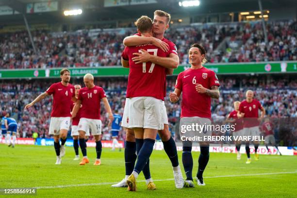 Norway's midfielder Ola Solbakken celebrates scoring the opening goal with his teammate Norway's forward Alexander Sorloth during the UEFA Euro 2024...