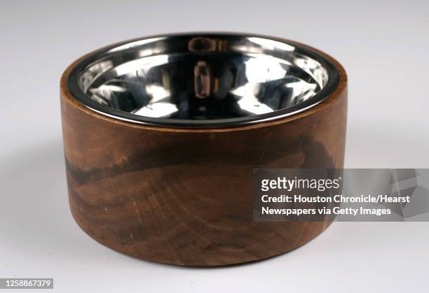 Carved-wood dog bowl, $44, Kuhl-Linscomb photographed in the Houston Chronicle studio, Thursday, June 30 in Houston. For Gloss Dog.