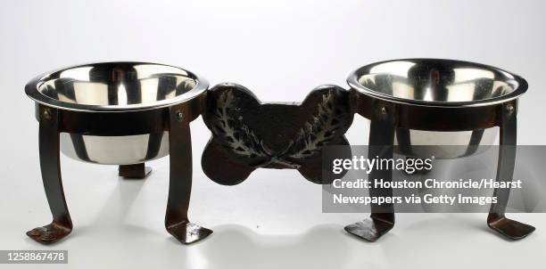 Jan Barboglio iron dog bowl set $190, Neiman Marcus photographed in the Houston Chronicle studio, Thursday, June 30 in Houston. For Gloss Dog.