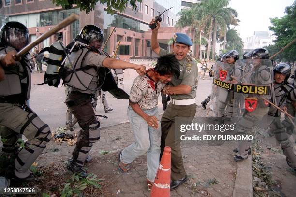 Indonesian soldiers beat a protester during clash in Jakarta 15 October 1999. Security forces clashed with more than 1,000 students and local...