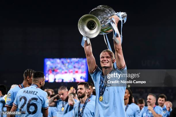 Erling Haaland of Manchester City FC celebrates with the trophy during the award ceremony following the UEFA Champions League final football match...