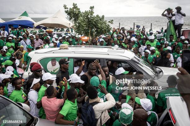 President of Sierra Leone and Leader of Sierra Leone People's party , Julius Maada Bio, waves to his supporters during his final campaign rally in...