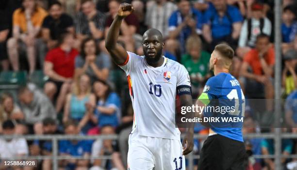 Belgium's Romelu Lukaku celebrates after scoring the 0-2 goal while Estonia's captain Karol Mets shows deception at the match Estonia vs Belgian...