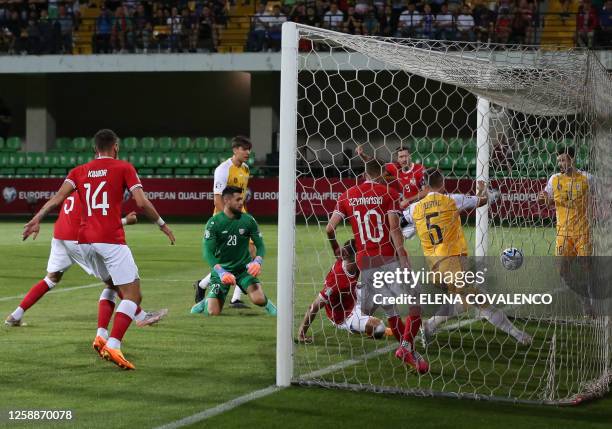 Poland's Arkadiusz Milik scores his team's first goal during the group E Euro 2024 qualifier football match between Moldova and Poland at Zimbru...