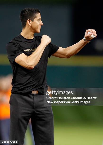 Olympic Silver Medalist in Taekwondo, Mark Lopez throws out the first pitch of an MLB baseball game at Minute Maid Park on Tuesday, May 8 in Houston.
