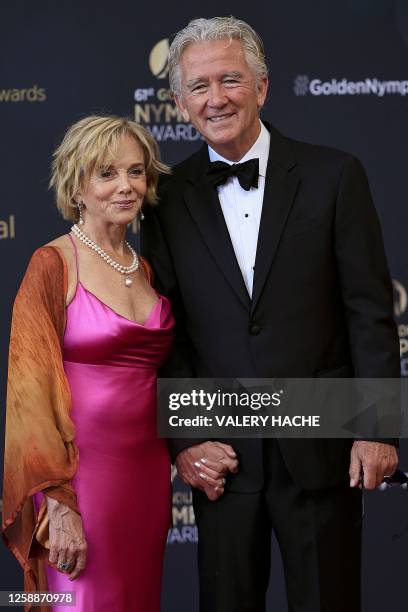 Actor Patrick Duffy and his partner Linda Purl pose during a photocall for the Golden Nymph Awards ceremony of the 62nd Monte-Carlo Television...