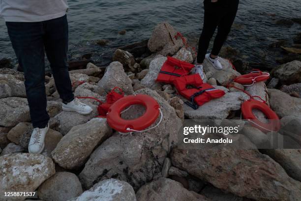 Communist's Party Youth throws lifebuoys into the sea as a symbolic demonstration for refugee rights after a fishing boat carrying migrants trying to...