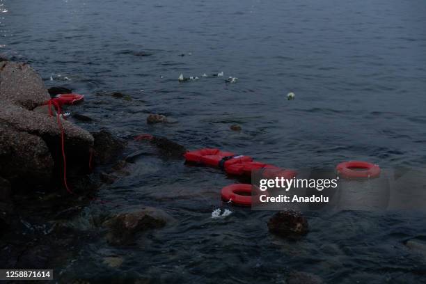 Communist's Party Youth throws lifebuoys into the sea as a symbolic demonstration for refugee rights after a fishing boat carrying migrants trying to...