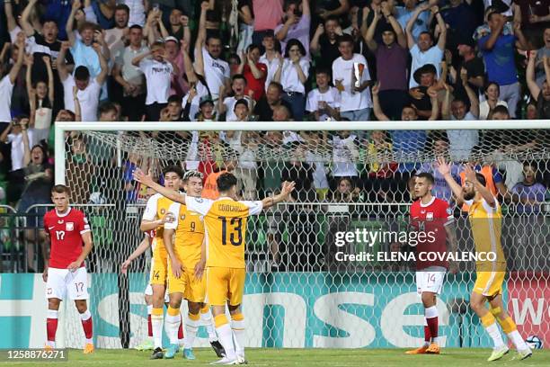 Moldavian players celebrate a goal against Poland during the group E Euro 2024 qualifier football match between Moldova and Poland at Zimbru Stadium...