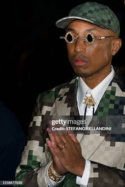 Louis Vuitton' fashion designer and singer Pharrell Williams gestures during the Louis Vuitton Menswear Spring-Summer 2024 show as part of the Paris...