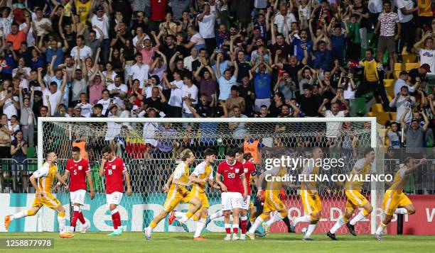 Moldavian players celebrate their team's third goal against Poland during the group E Euro 2024 qualifier football match between Moldova and Poland...