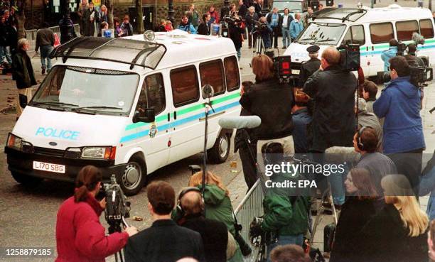 Two police vans carrying the two 11-year-old boys accused of murdering Liverpool toddler James Bulger arrive at Preston Crown Court in England 01...
