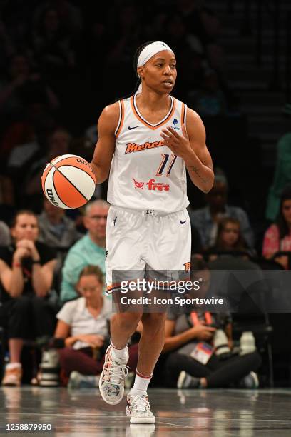 Phoenix Mercury guard Shey Peddy brings the ball up the court during a WNBA game between the Phoenix Mercury and the New York Liberty on June 18,...