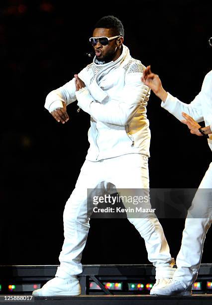 Usher performs with The Black Eyed Peas during the Bridgestone Super Bowl XLV Halftime Show at Dallas Cowboys Stadium on February 6, 2011 in...