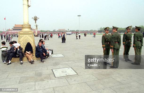 Chinese People's Armed Police stand on patrol at Tiananmen Square, on the lookout for followers of the outlawed Falungong sect, 24 April 2000 in...