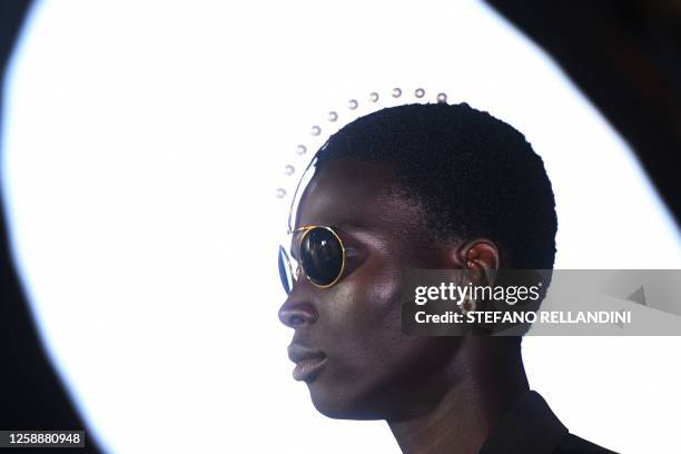 Model presents a creation for the Louis Vuitton Menswear Spring-Summer 2024 show as part of the Paris Fashion Week on the Pont Neuf, central Paris,...