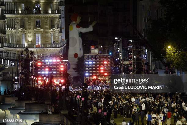 Artist Shawn Corey Carter aka Jay-Z performs for a free show on the Pont Neuf, past the statue of Henry IV, the Samaritaine building in the...
