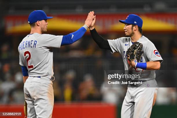 Nico Hoerner celebrates with Seiya Suzuki of the Chicago Cubs after a 4-0 win over the Pittsburgh Pirates at PNC Park on June 20, 2023 in Pittsburgh,...