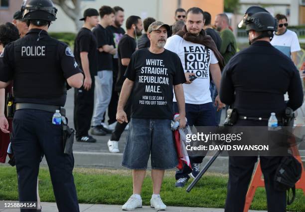 Police look on as protesters gather outside the Glendale Unified School District headquarters in Glendale, California, on June 20, 2023. Over 300...