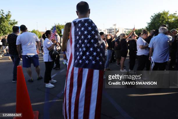 Protesters gather outside the Glendale Unified School District headquarters in Glendale, California, on June 20, 2023. Over 300 people gathered...