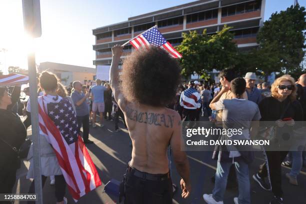 Protesters gather outside the Glendale Unified School District headquarters in Glendale, California, on June 20, 2023. Over 300 people gathered...