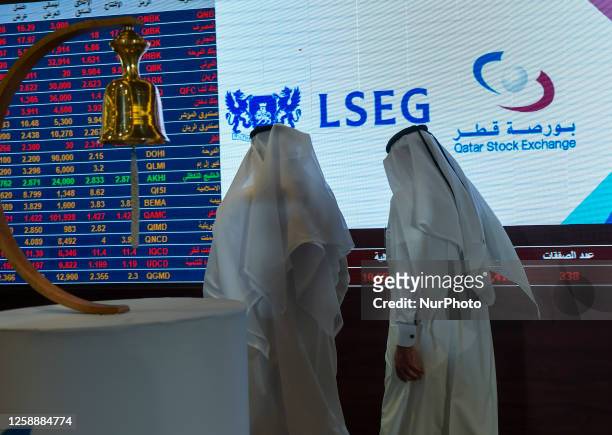 Traders observe the stock market at Qatar Stock Exchange during the launch ceremony of new trading platform held in Doha, Qatar on 20 June 2023.The...