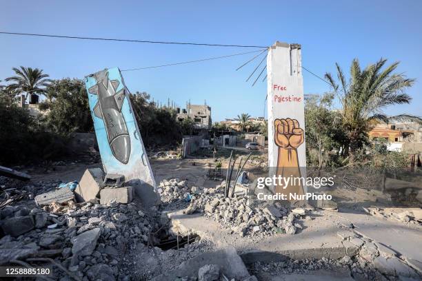 Graffiti mural inside a rubble of building destroyed by Israeli air strikes during the May 2023 conflict in Deir alBalah in the central Gaza Strip,...