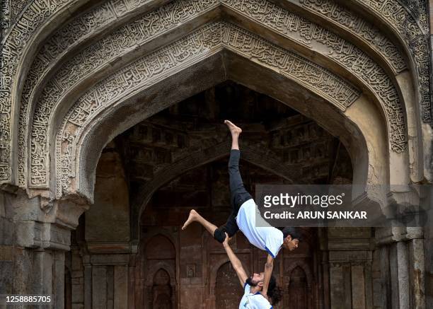 Youth enthusiasts take part in a yoga session at Lodhi gardens on International Day of Yoga, in New Delhi on June 21, 2023.
