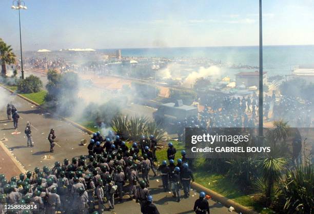 Anti-globalisation activists clash with anti-riot police during an anti-G8 demonstration 21 July 2001. Italian police and protestors clashed Saturday...